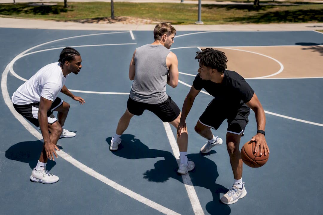 Players executing assigned roles in basketball scrimmage drill