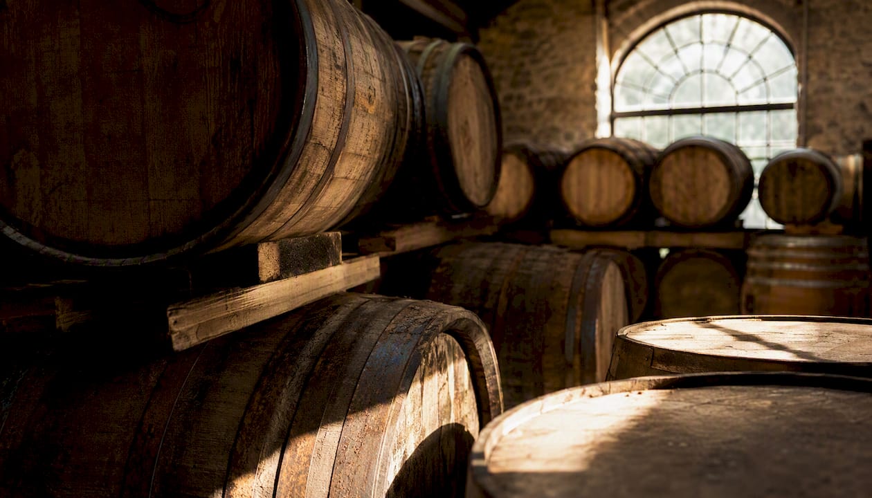 Whisky barrels in maturation warehouse