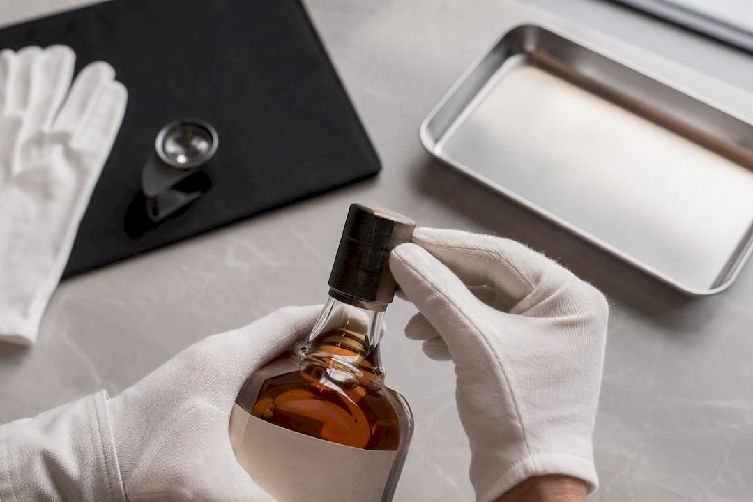 Inspecting whisky seal and fill level