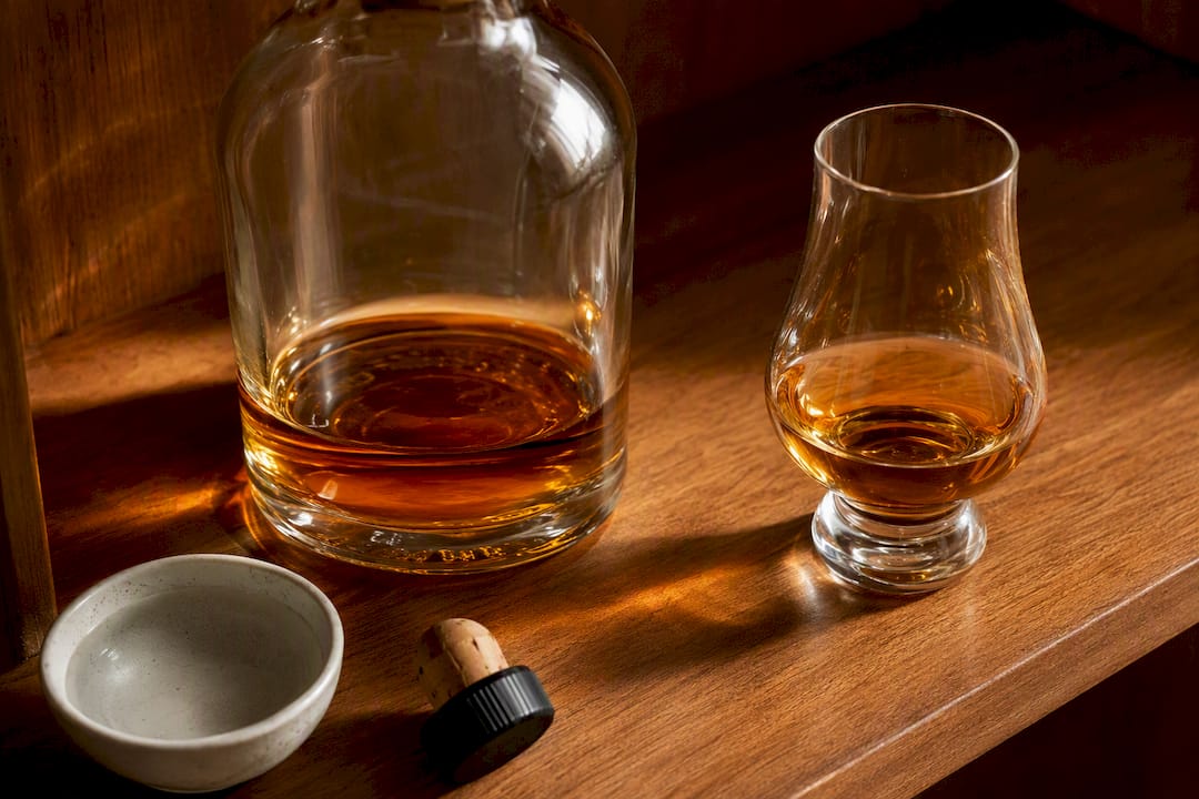 Anonymous whisky bottle showing changing fill level