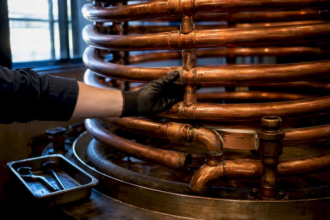 Copper worm tub condenser coils