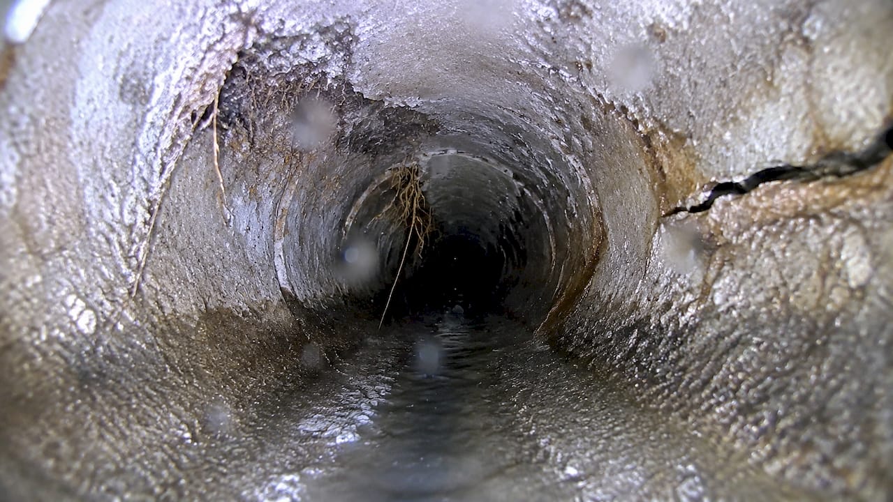 Close-up of sewer pipe defects from camera