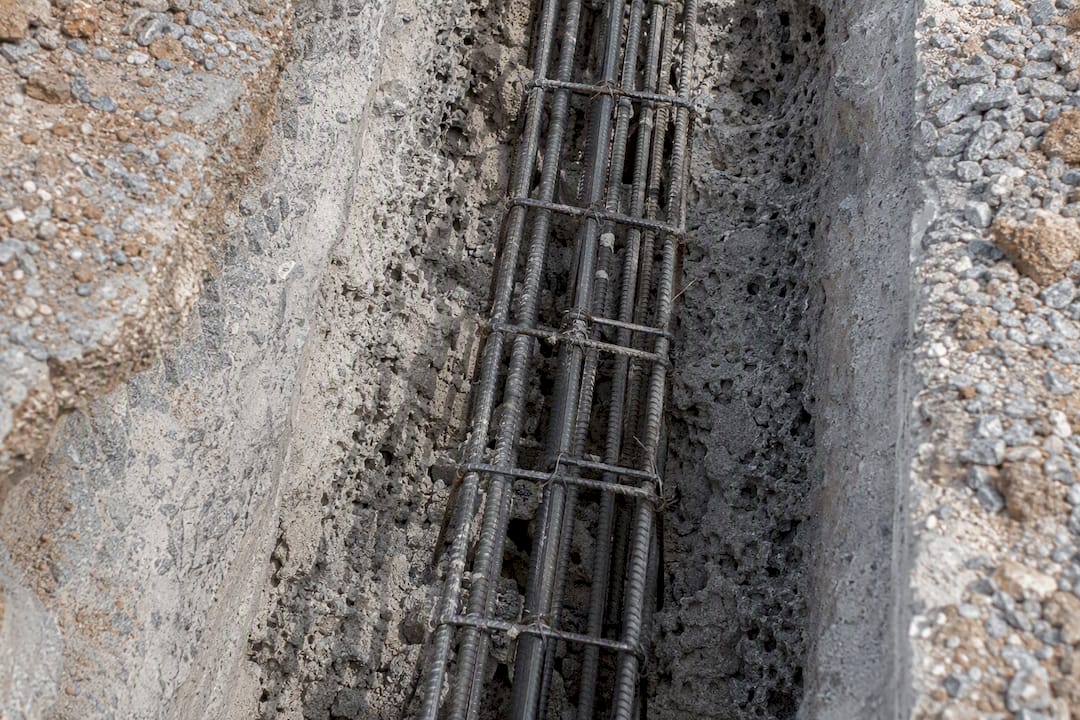 Close-up of congested rebar with honeycombing concrete defects