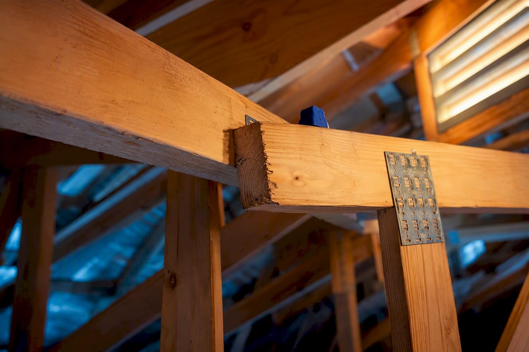 Cut roof truss joint in Gulf Coast attic
