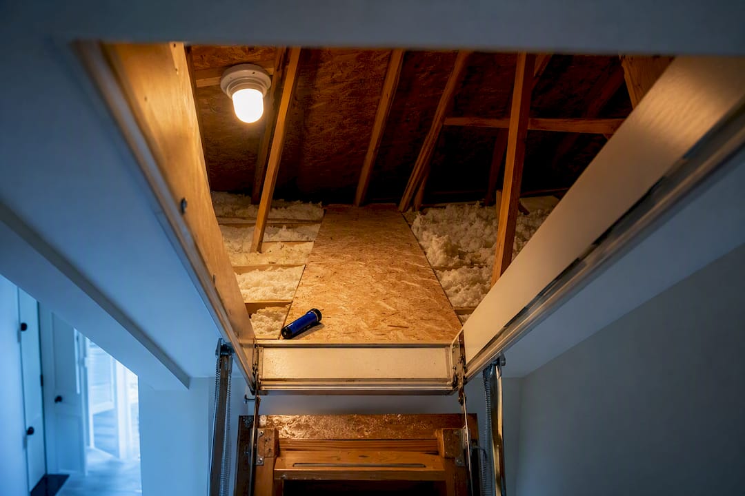 Lit attic hatch beside safe walkway