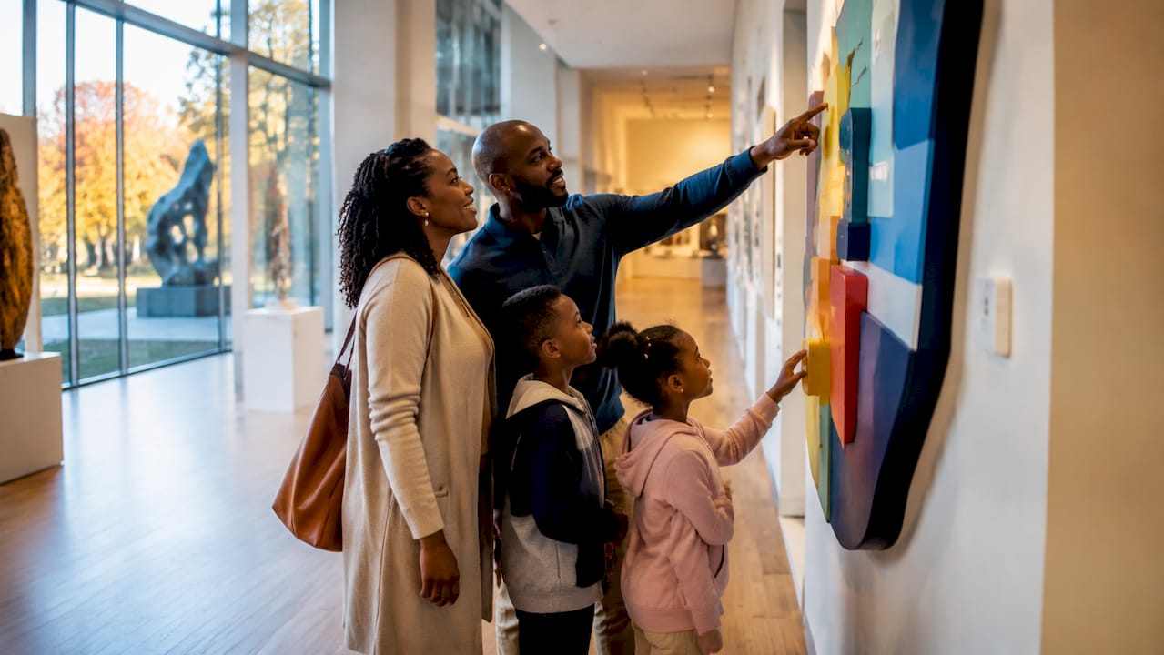 Visitors reading indoor directional signs