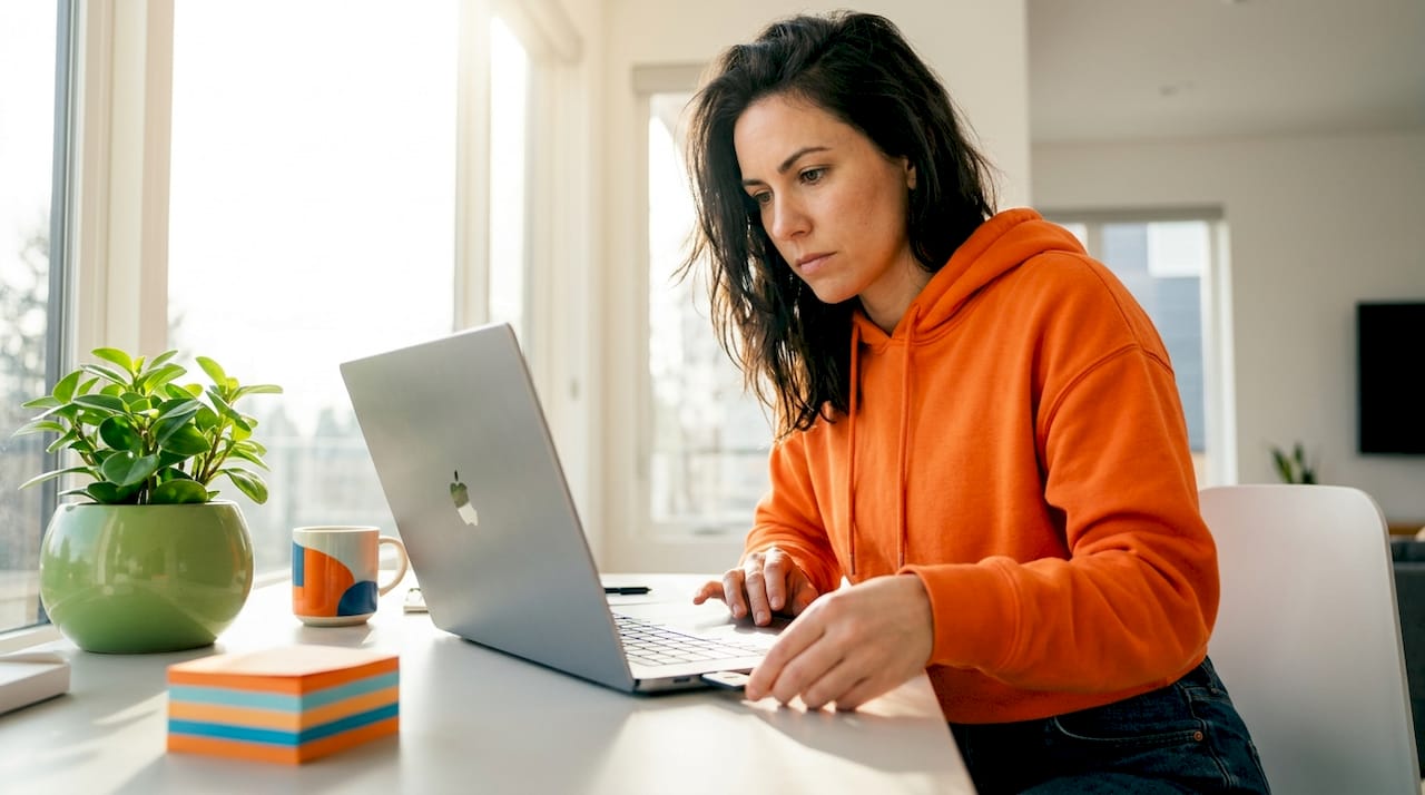 Woman using hardware security key on laptop