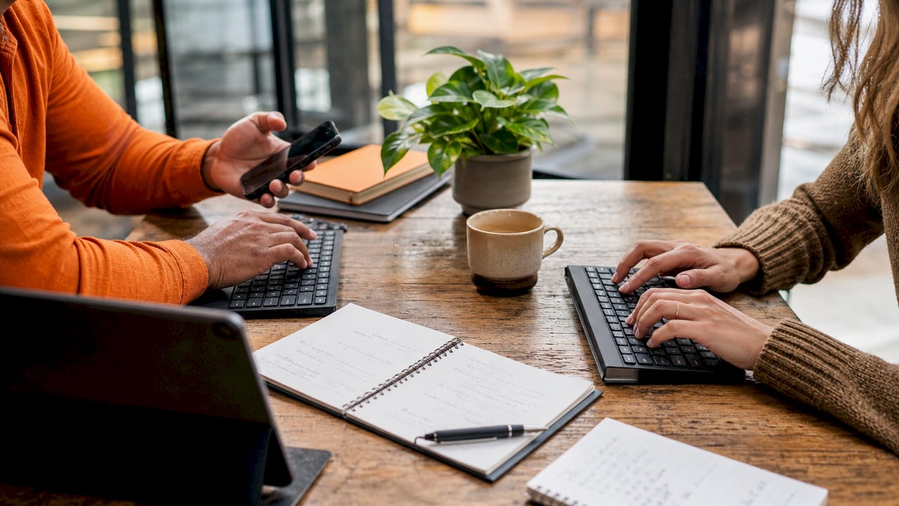 Hands typing on keyboards amid password reuse discussion