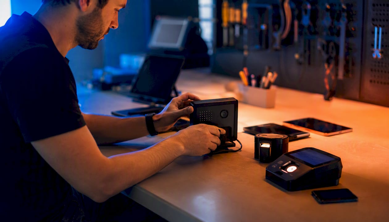 Cloud-Based Authentication Systems: The IT Leader's Guide 1 Hands checking device posture in security lab