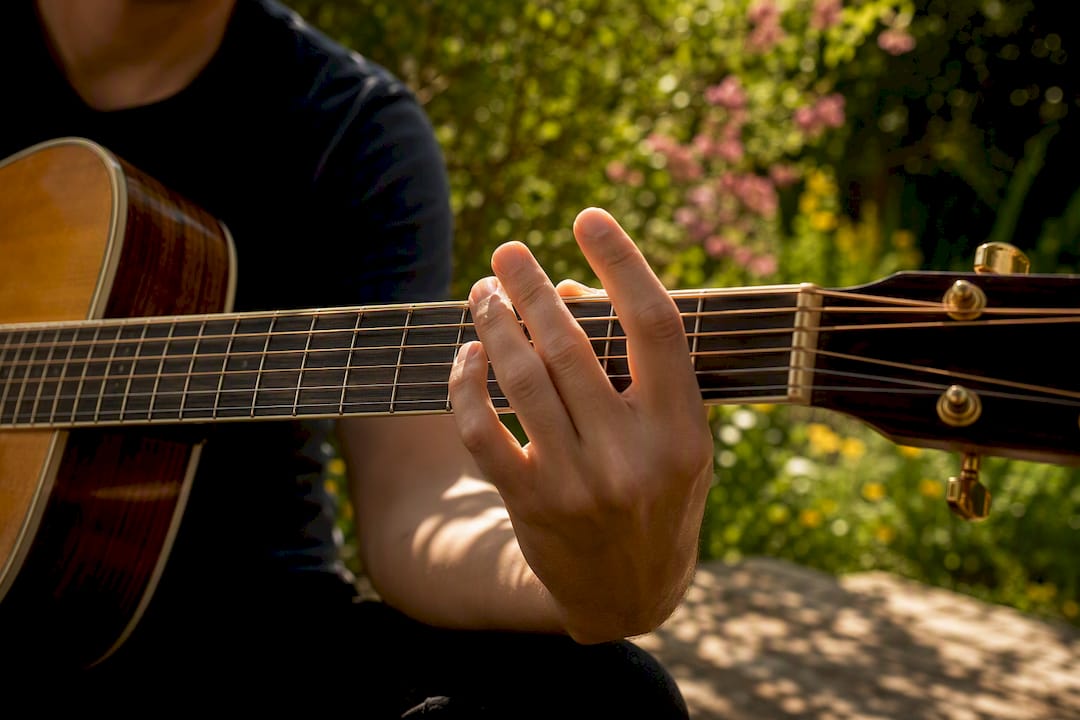 Hand muting guitar strings for ghost notes