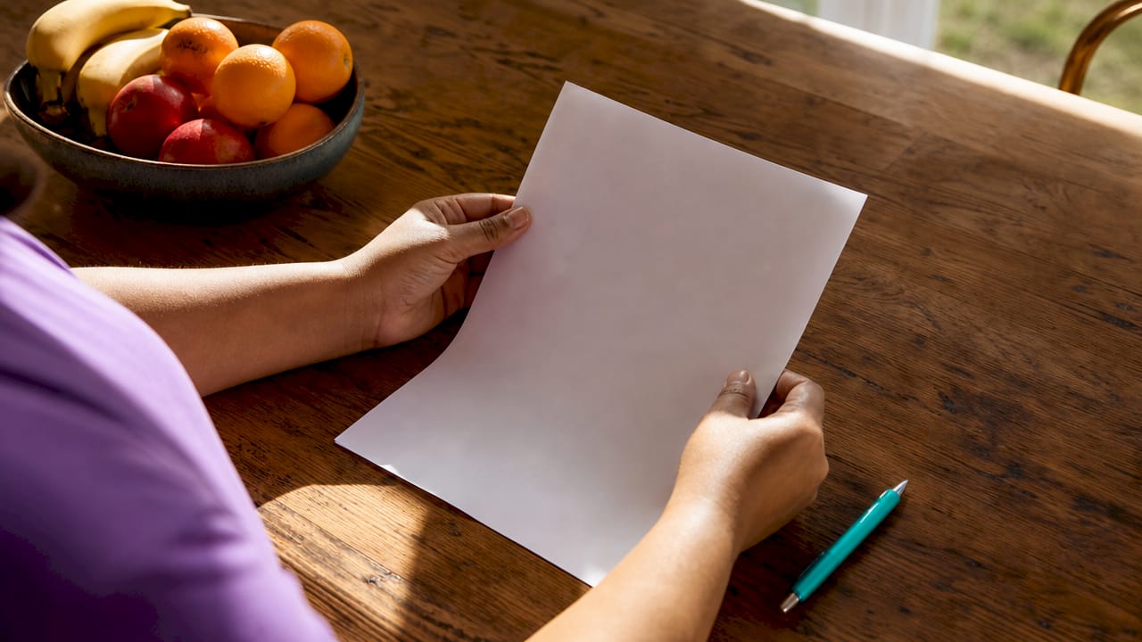 Hands holding no-obligation offer document