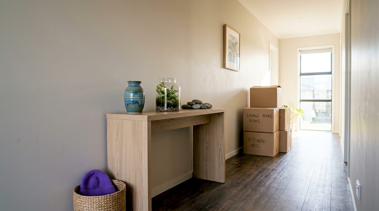 Organized hallway with removal boxes for decluttering