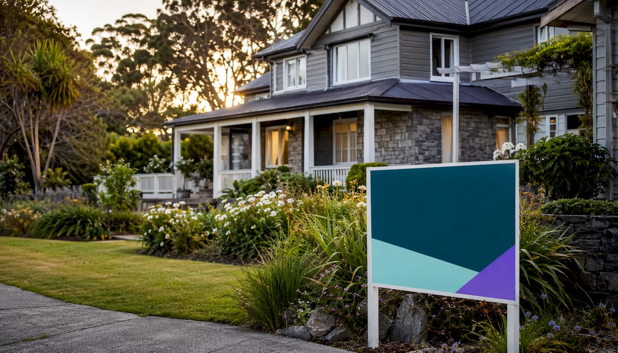 Typical New Zealand house with sold sign