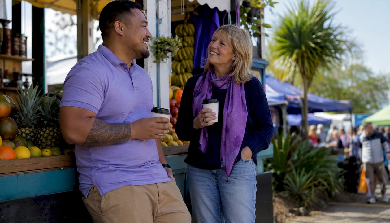 Kiwi landlord and Pacifica tenant talking outdoors