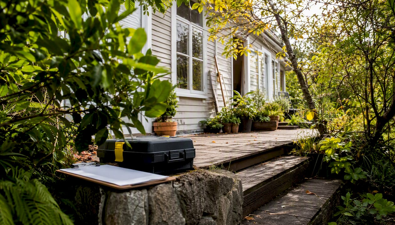 NZ house exterior with building inspection tools