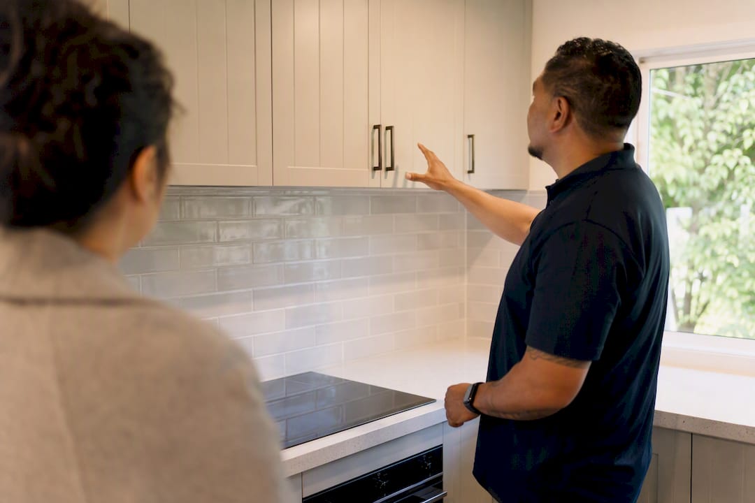 Hands pointing to home renovation during inspection