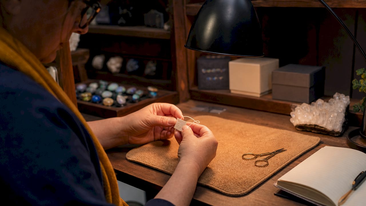 Hands scanning jewelry inventory barcode
