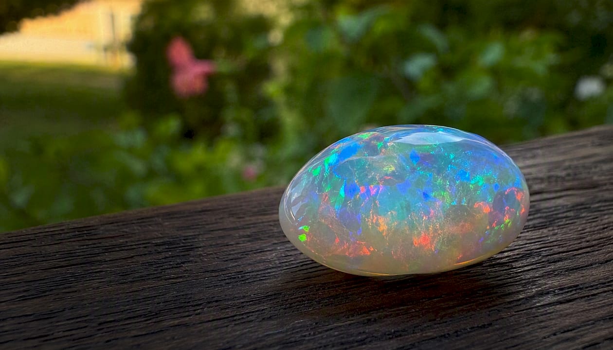 Polished Ethiopian Welo opal showing large color flashes
