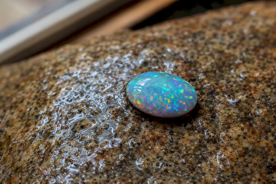 Close-up of Australian opal with water droplets