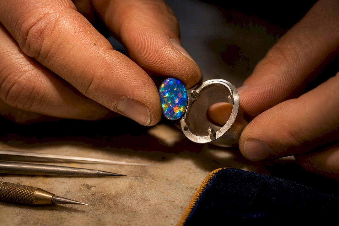 Opal cabochon aligned with ring setting