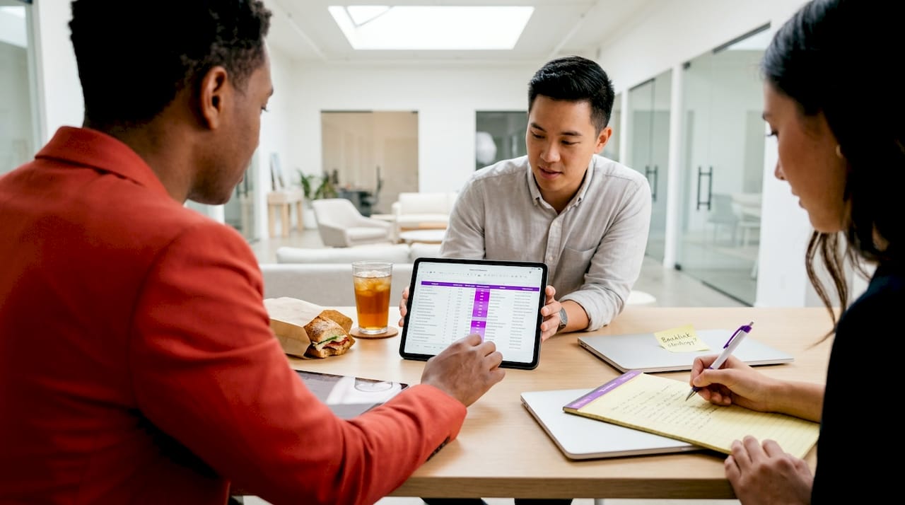 Team mapping SaaS marketing keywords in office