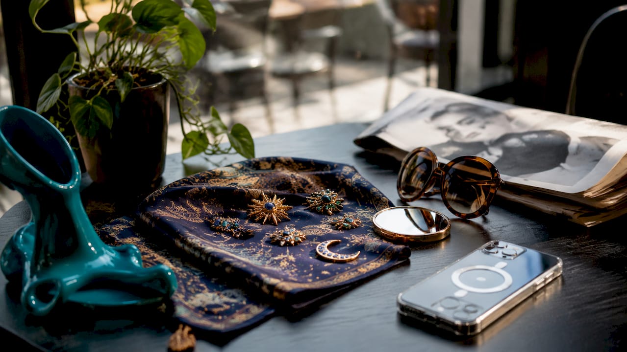 Overhead view of bold fashion accessories on table