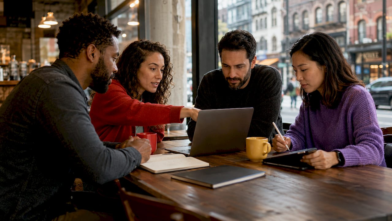 SaaS analytics team collaborating in office