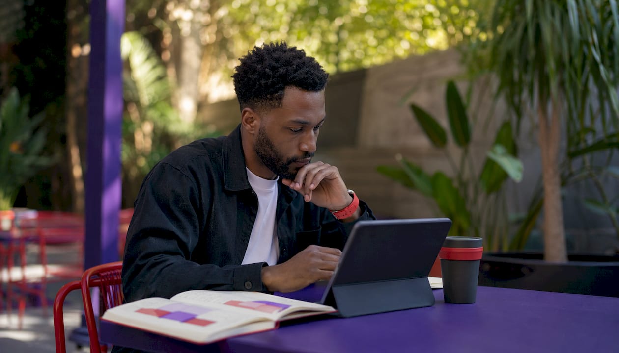 Hands using tablet for AI personalization work