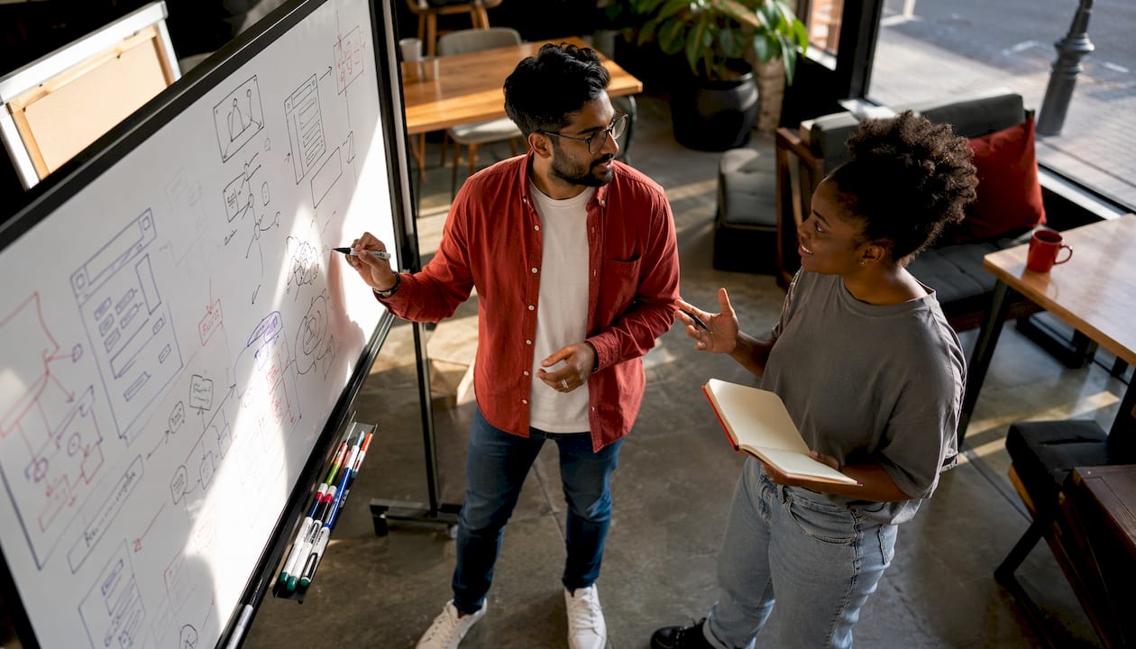 Two developers discussing architecture designs