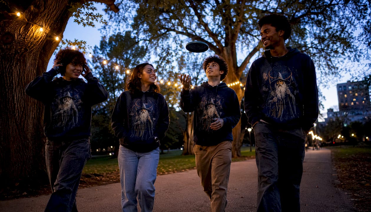 Friends in graphic hoodies on urban street