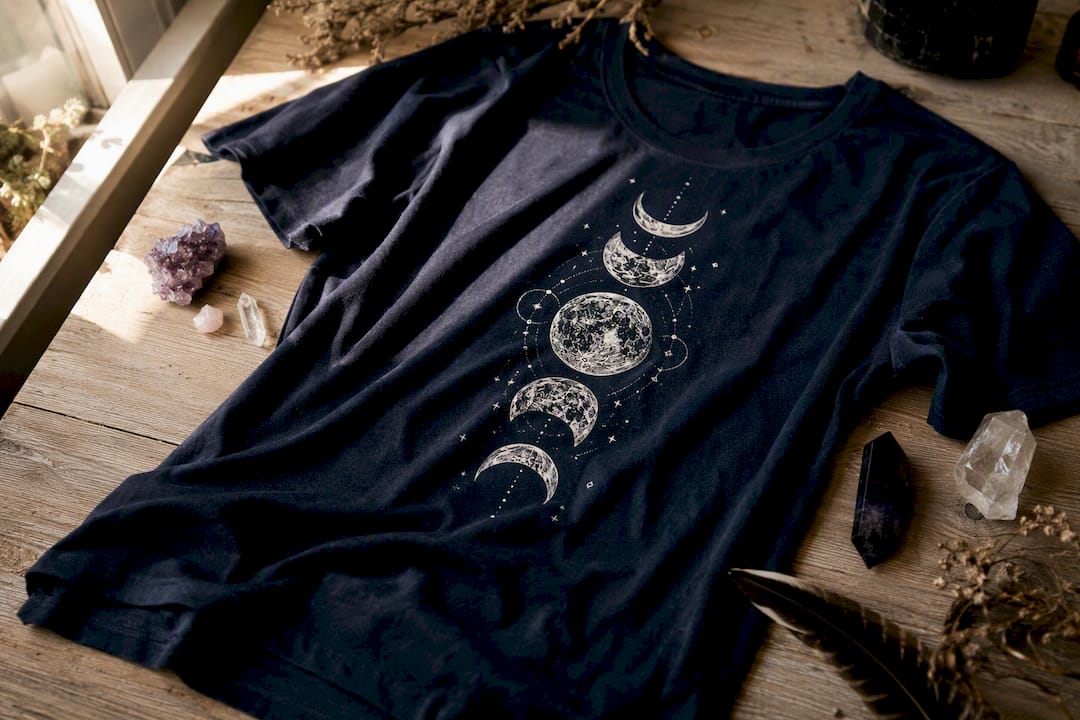 Folded navy t-shirt with moon phases print