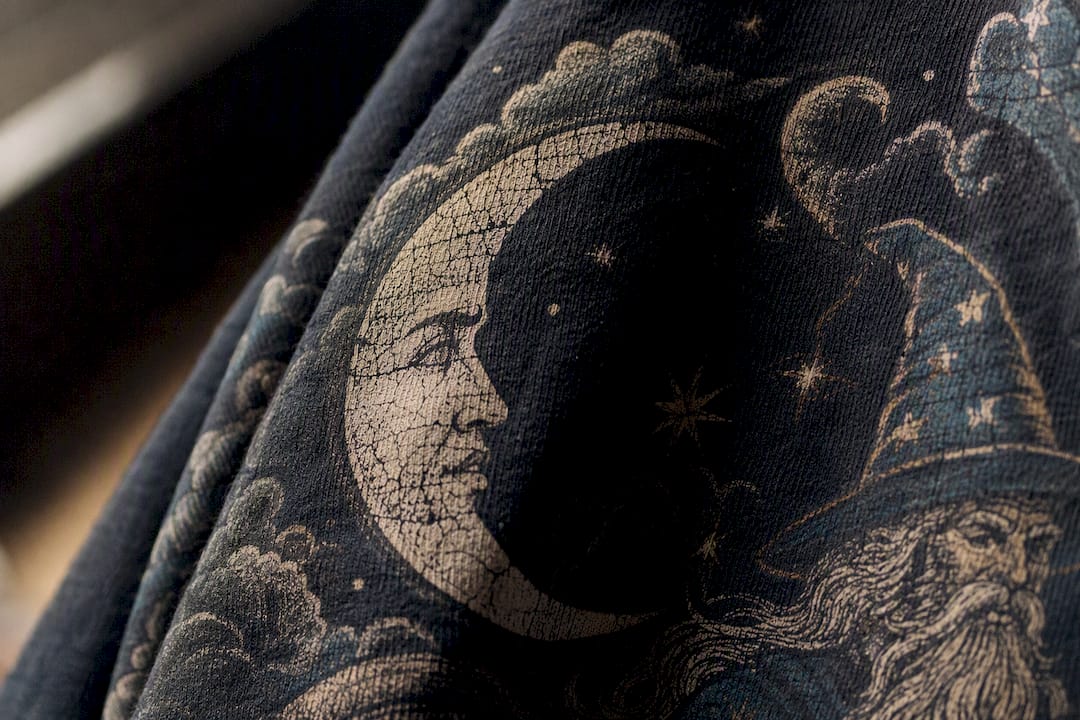 Close-up of distressed graphic tee print