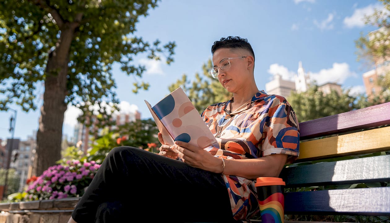 Non-binary professional researching LGBTQ+ candidates