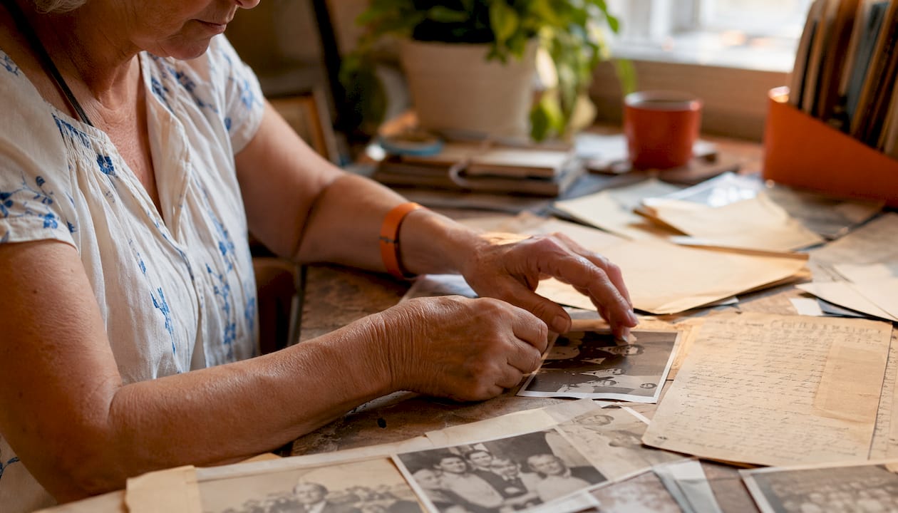 Hands sorting historical gay rights documents