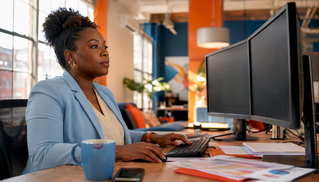 HR analyst reviewing diversity metrics dashboard