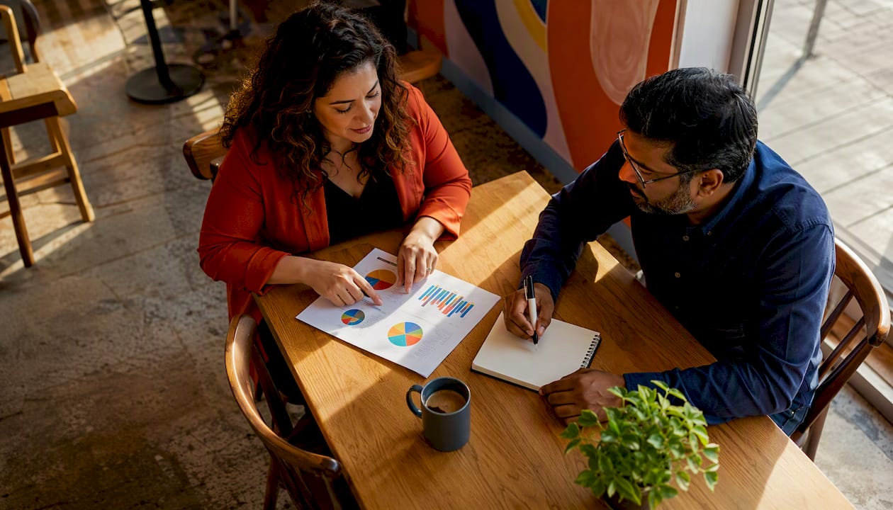 Two colleagues discussing retention in office