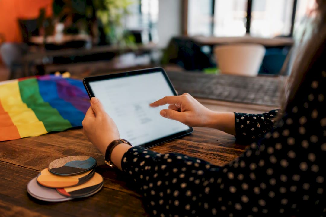 Hands adjusting gender neutral application form interface