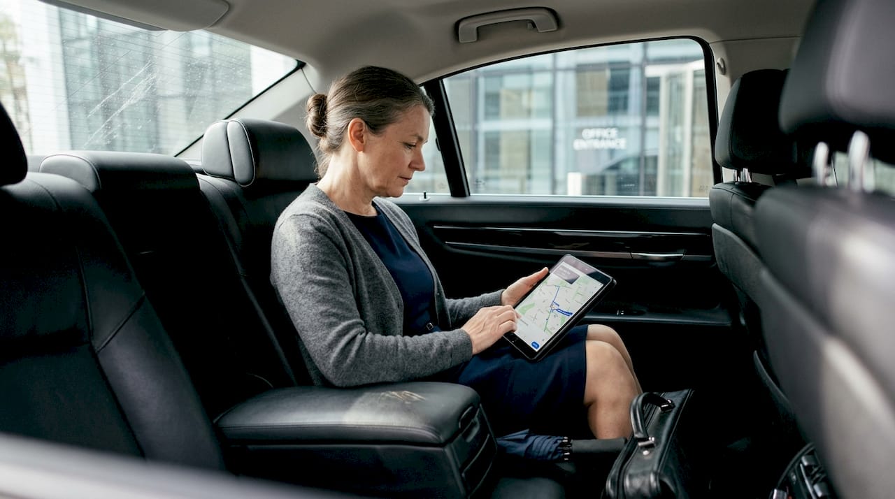 Businesswoman in BMW 7 Series for corporate journey