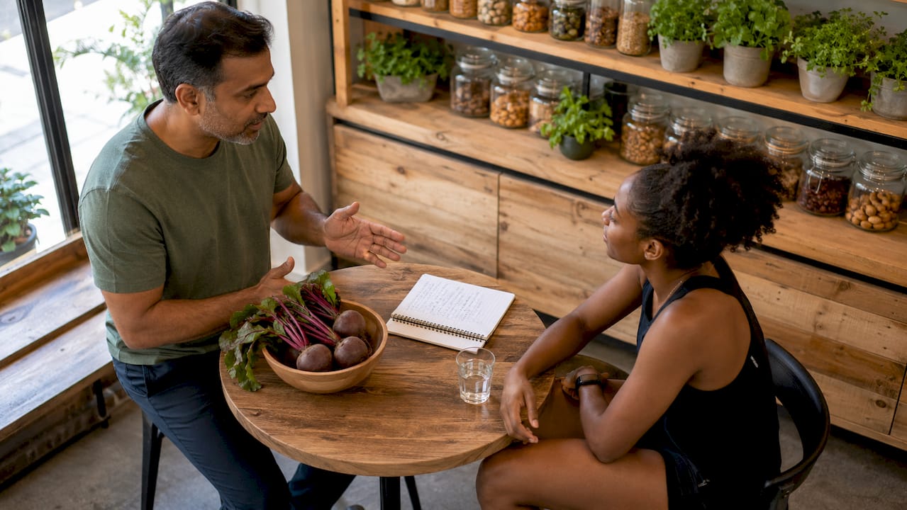 Sports nutritionist advising athlete on beetroot use