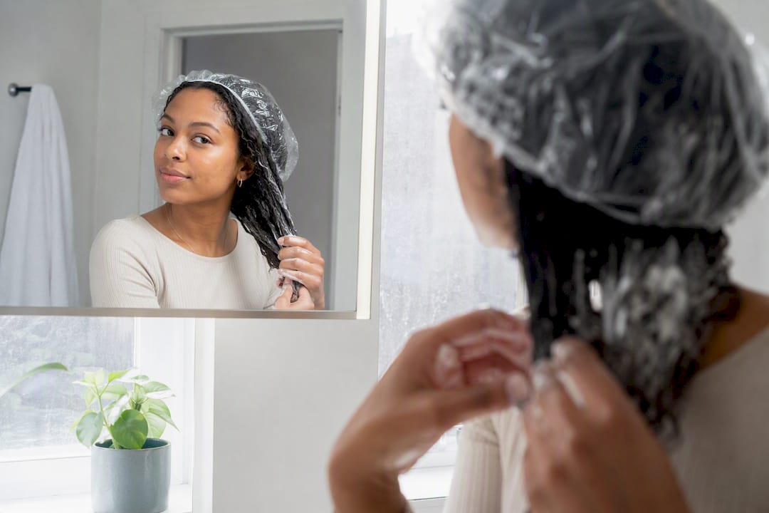 Applying deep conditioning mask on damp hair