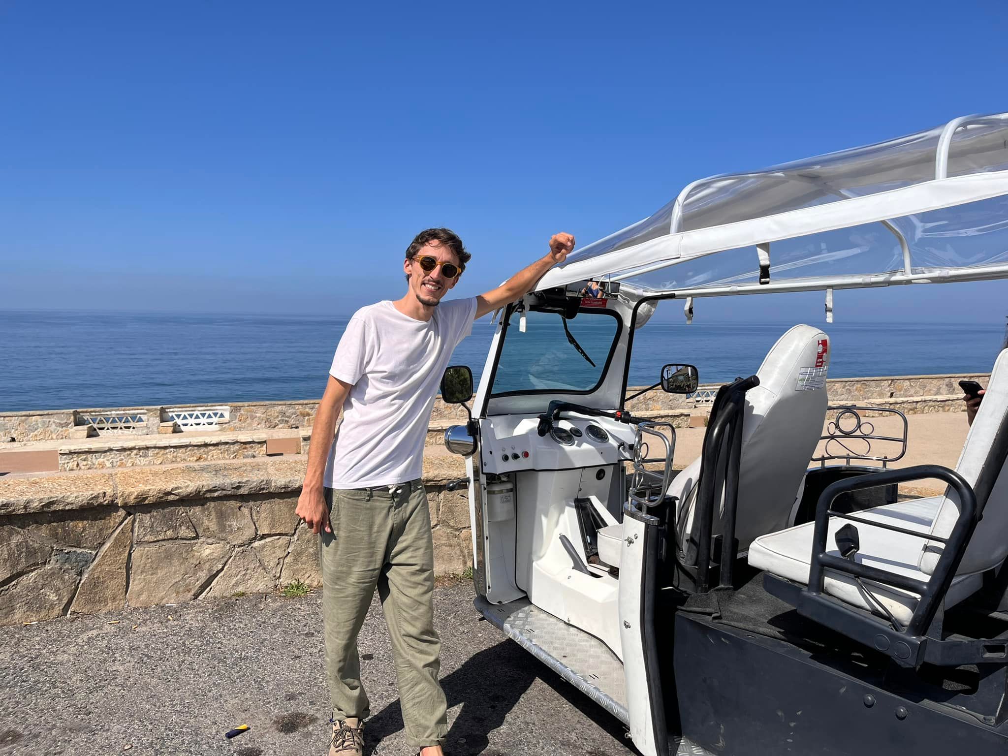 Electric tuk-tuk on Cascais coastal road