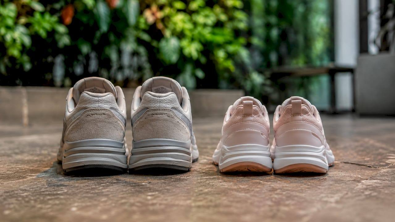 Close-up comparing men's and women's shoe shapes