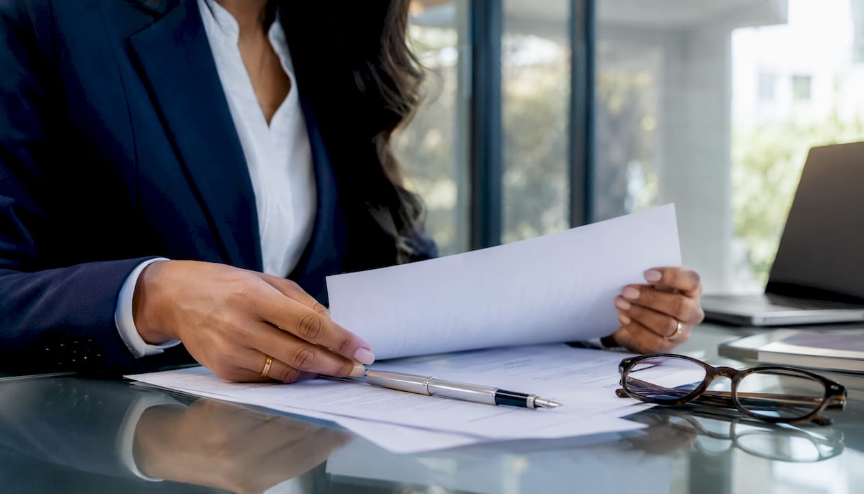 Close-up of legal professional reviewing documents