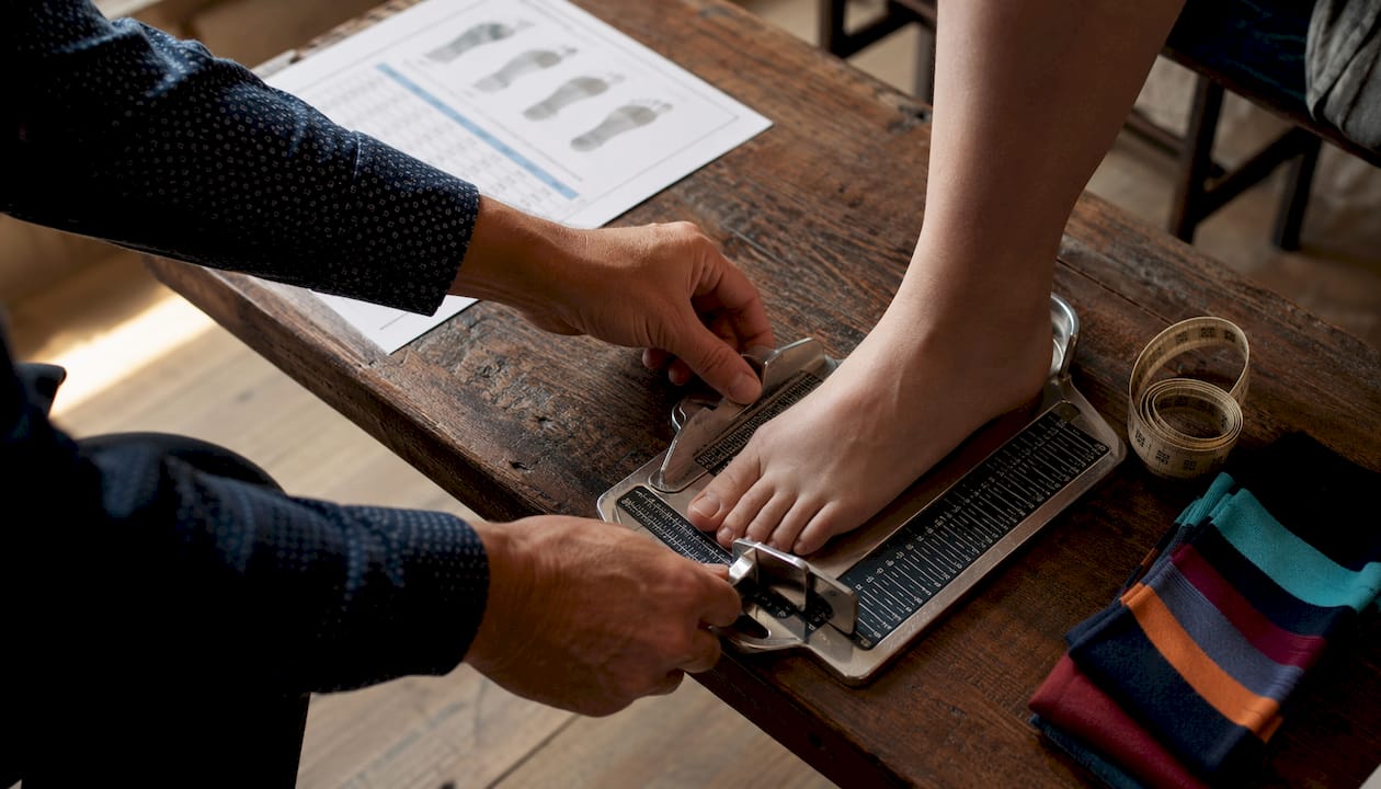 Close-up of foot measurement with Brannock device