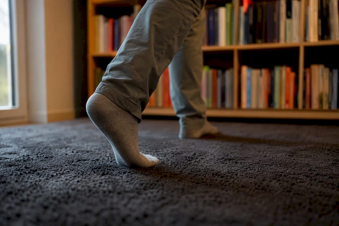 Foot walking indoors to check shoe fit