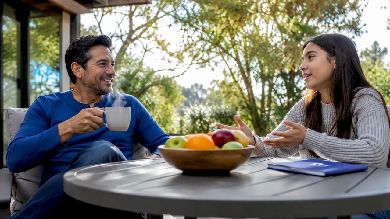Father and teenage daughter sharing open conversation