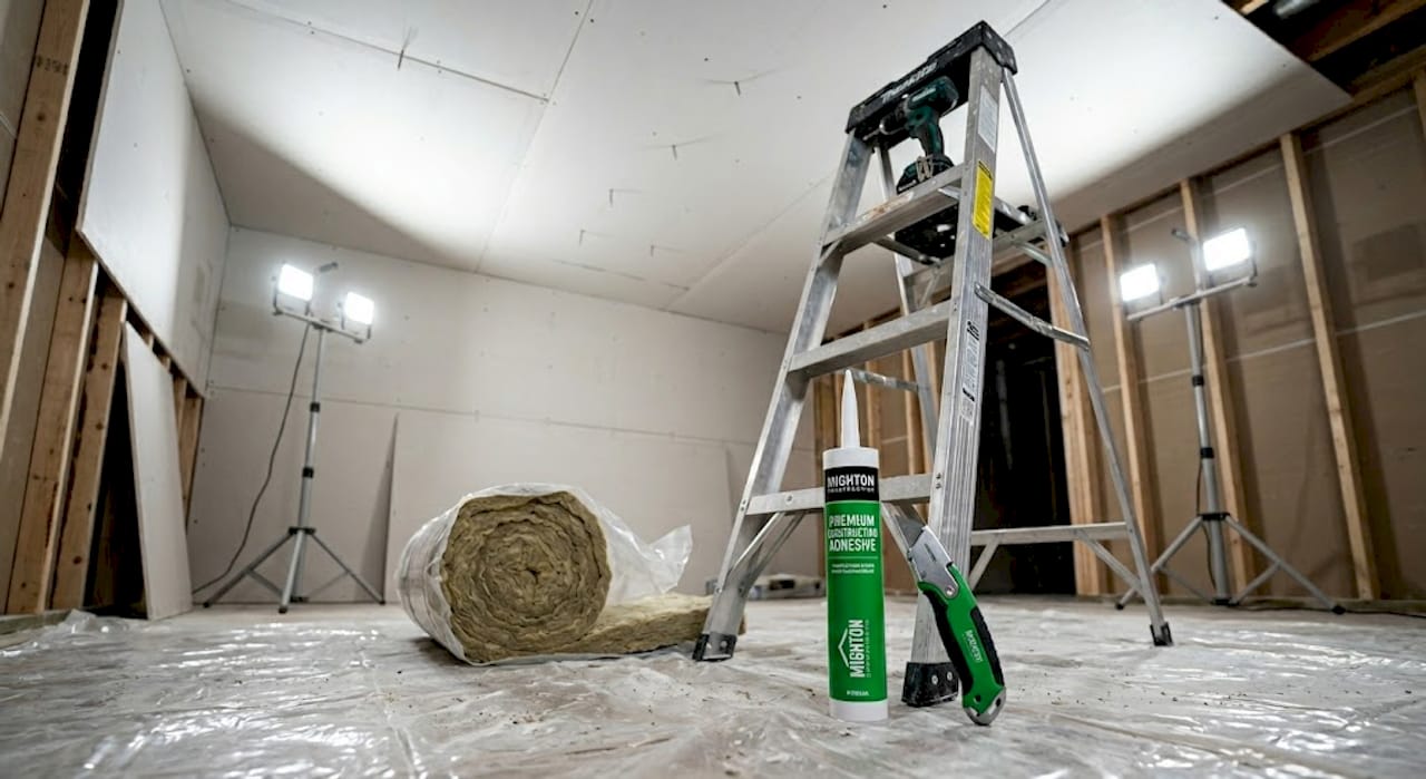 Contractor installing soundproof basement ceiling