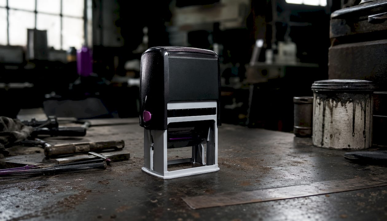 Close-up self-inking heavy duty stamp on workshop table