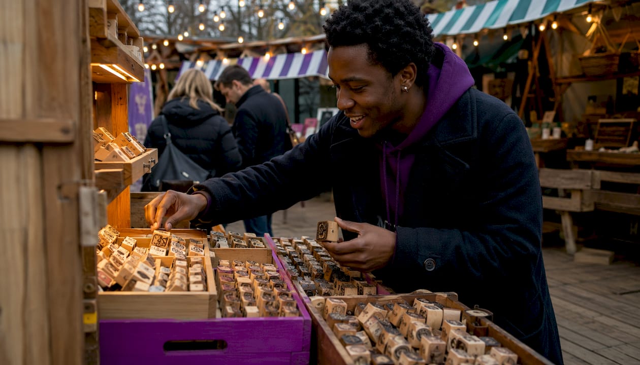 Artisan shopkeeper arranging stamps
