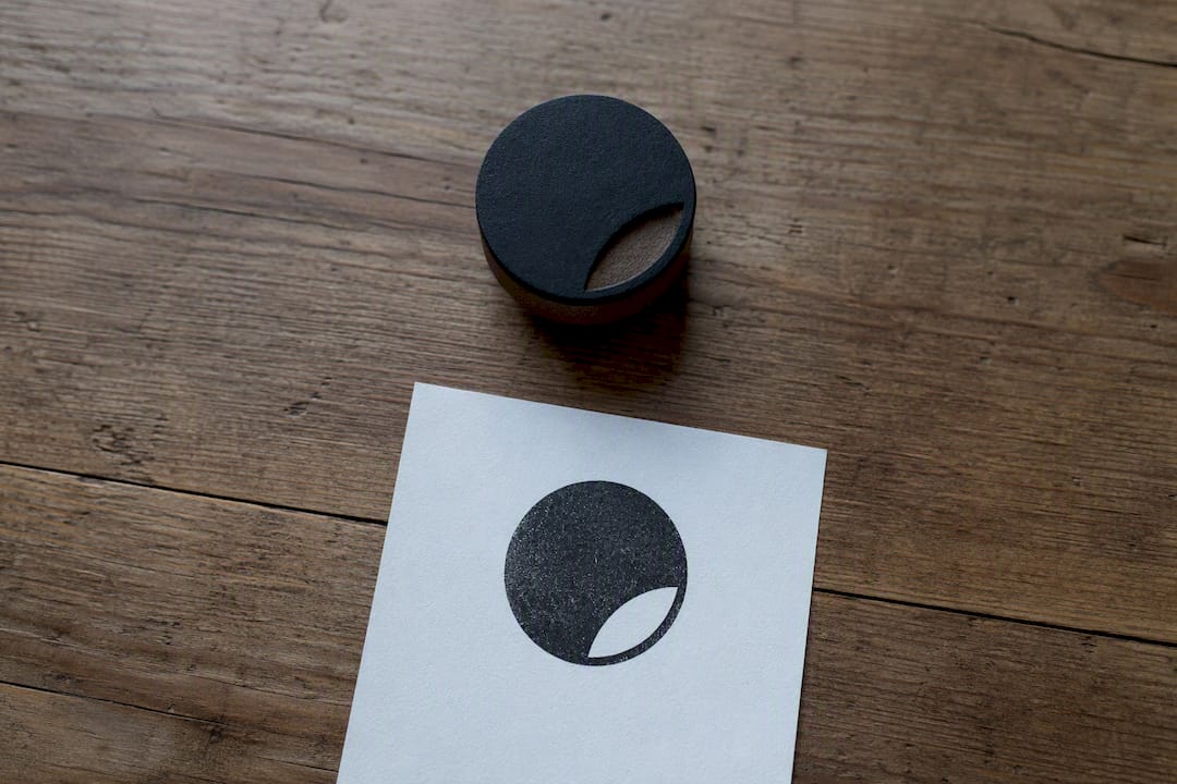Monochrome leaf logo rubber stamp impression